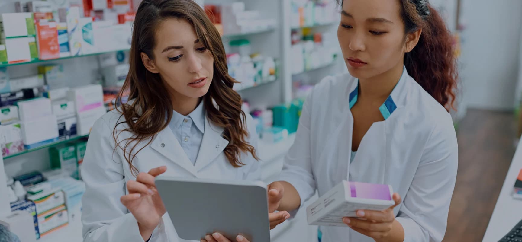 Pharmacy professionals learning on a tablet