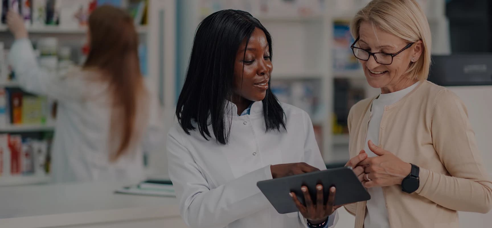 Pharmacy professionals reviewing learning information