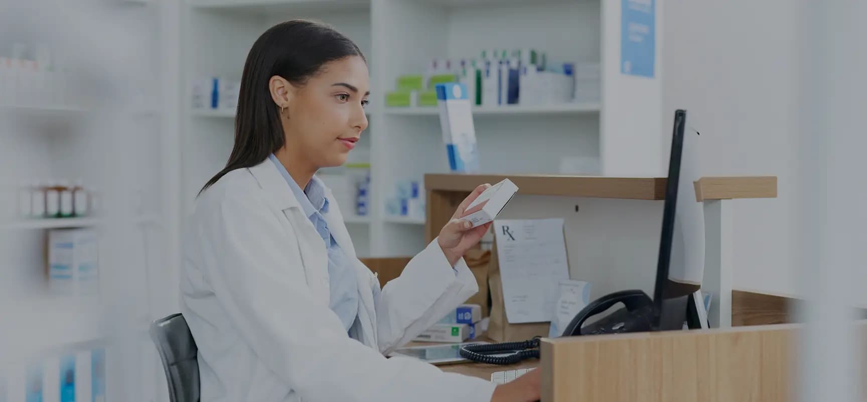 Pharmacy professional working at a counter
